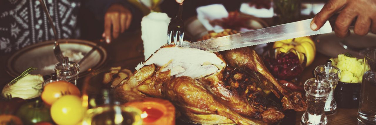 A man cutting turkey