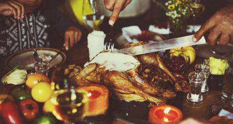 A man cutting turkey