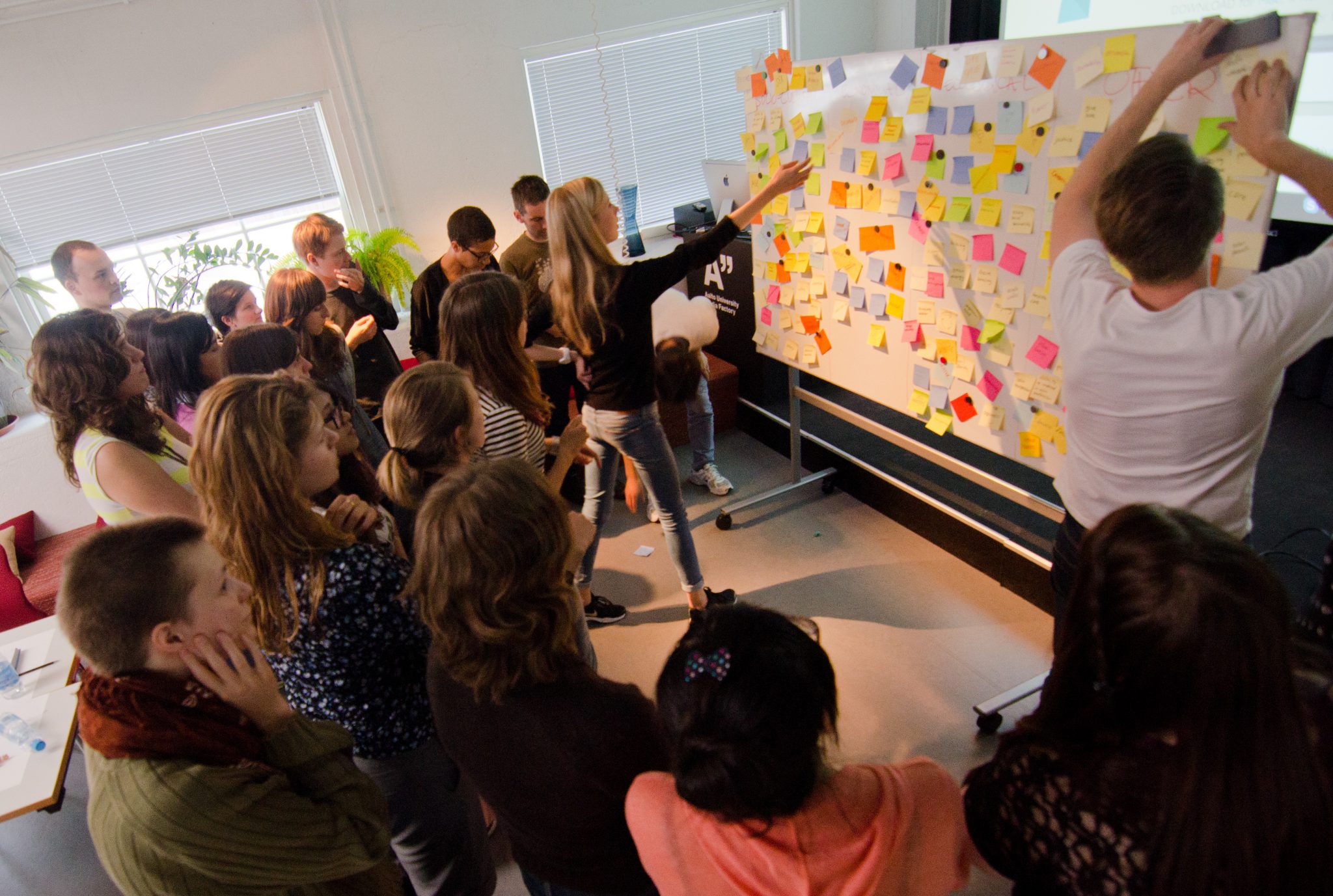 Brainstorming board with coloured Post-it notes