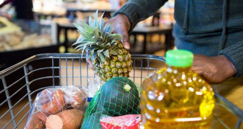 Man buying goods in grocery section