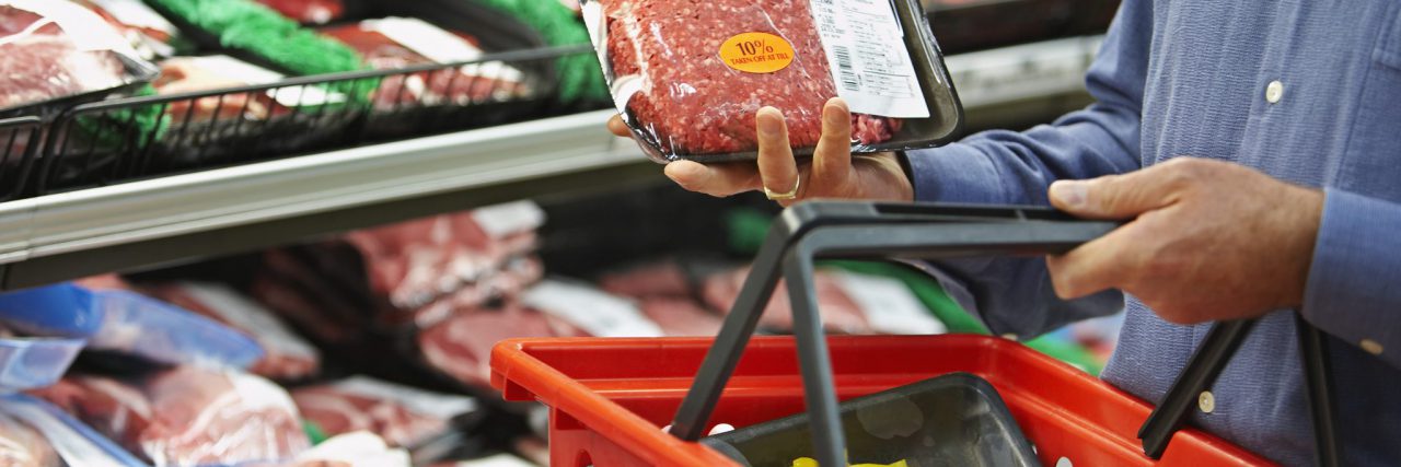 Packaged meat in shopping basket