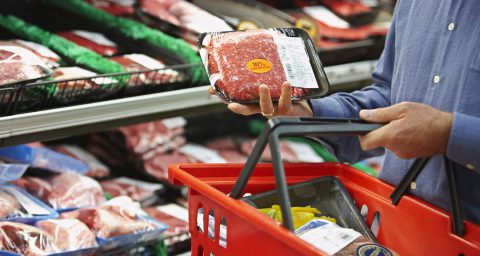 Packaged meat in shopping basket