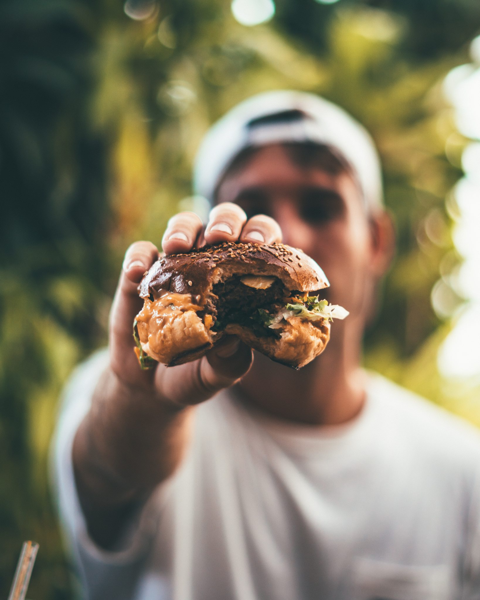 A man holding a burger